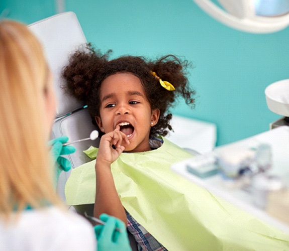 Dentist seeing child during an age one dental visit in Naperville, IL