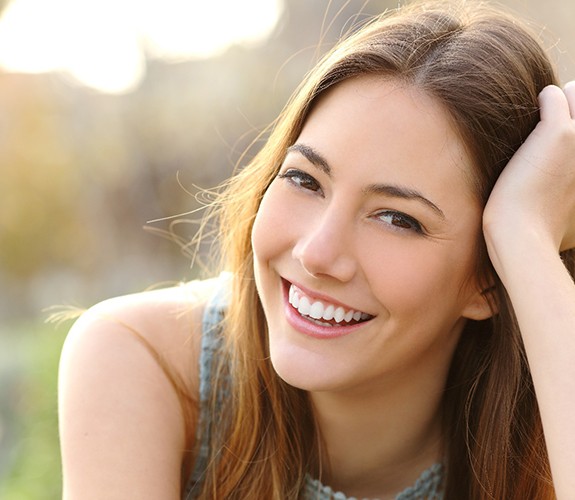 Woman smiling outside after Chao Pinhole® Surgical Technique in Naperville, IL
