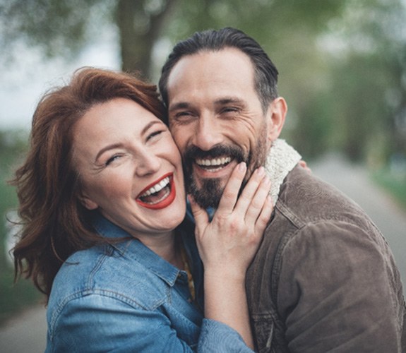 Couple smiling with dentures in Naperville 