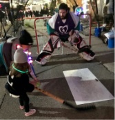 Doctor Monotya and his brother playing street hockey