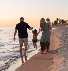 Doctor Well's and family on beach