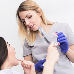 Emergency dentist in Naperville looking at patient