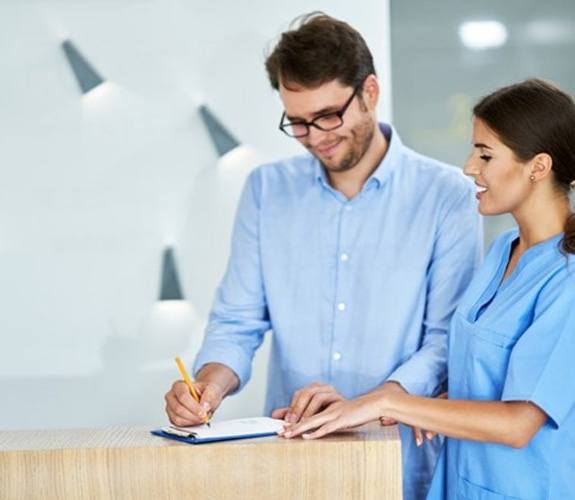 a patient paying their dental bill