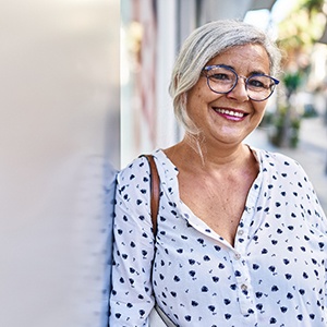 Woman smiling with dental implants in Naperville