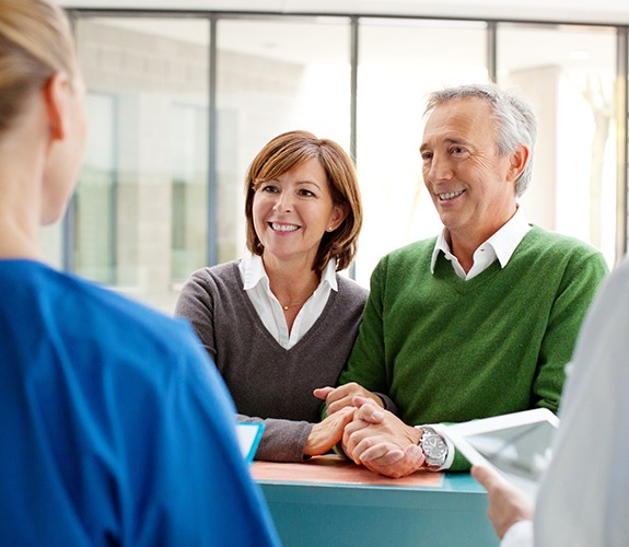 Two older patient reviewing dental insurance inforamtion