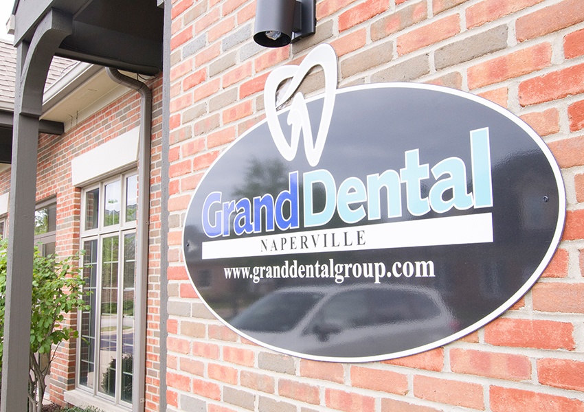 Grand Dental Naperville sign on dental office building
