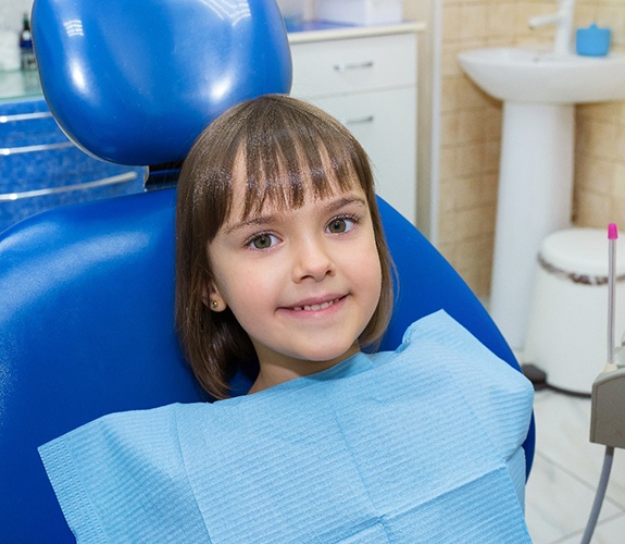 Young girl in dental chair at appointment for Phase 1 orthodontics in Naperville, IL