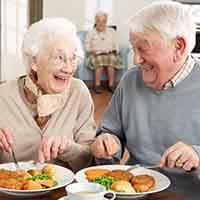 Older couple enjoying a healthy meal together