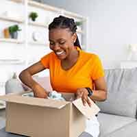 Woman opening a box