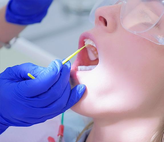 Patient receiving fluoride treatment