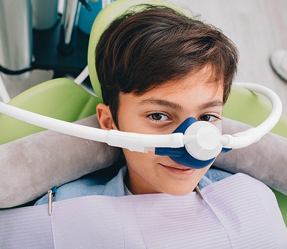 Young patient with nitrous oxide dental sedation mask