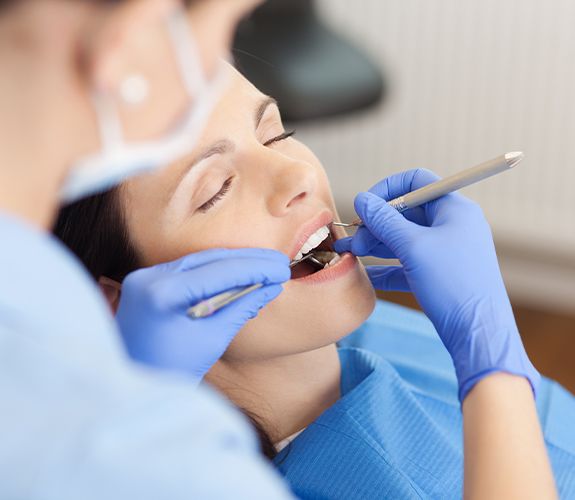 Patient receiving treatment under oral conscious dental sedation