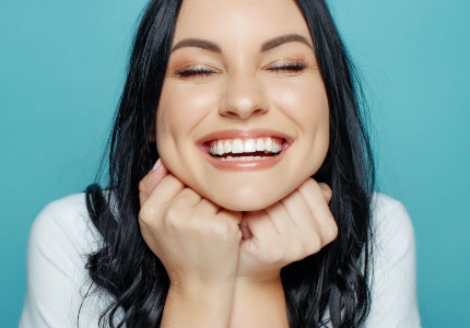 Woman with gorgeous smile after cosmetic dentistry