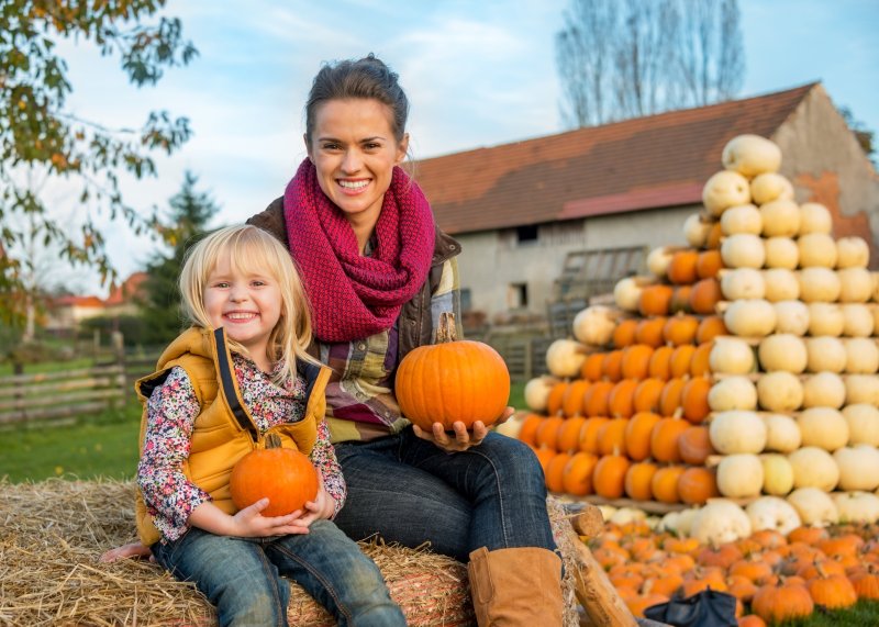 woman and child in the fall