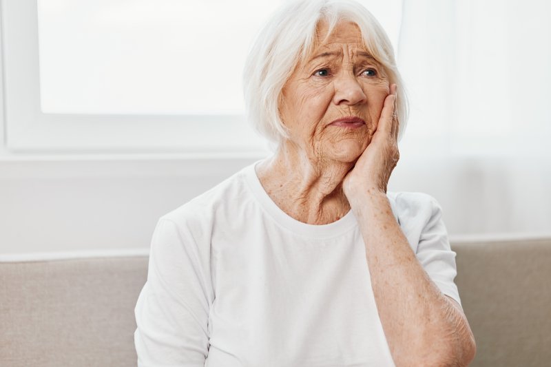 woman with ill-fitting dentures