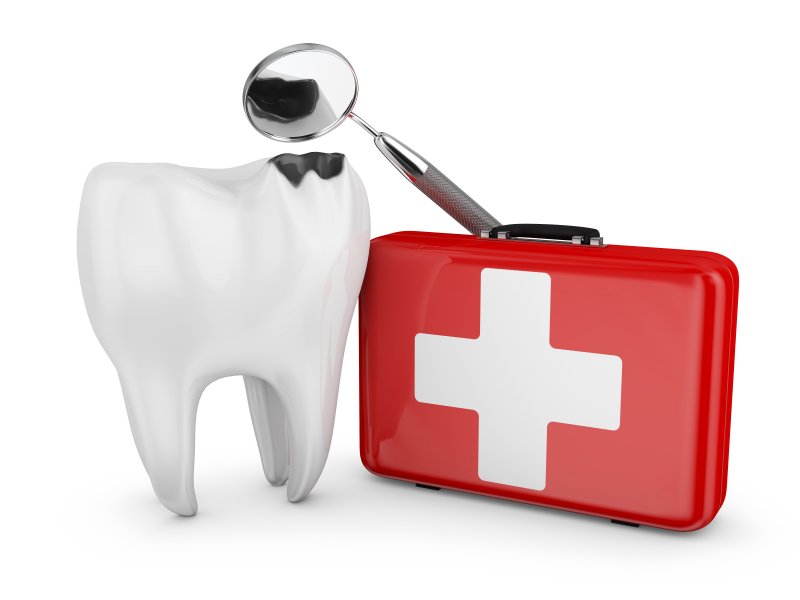 damaged tooth and first-aid kit